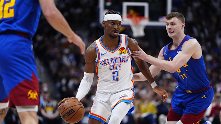 May 9, 2025; Denver, Colorado, USA; Denver Nuggets guard Christian Braun (0) defends Oklahoma City Thunder guard Shai Gilgeous-Alexander (2) in the first quarter during game three of the second round for the 2025 NBA Playoffs at Ball Arena. Mandatory Credit: Ron Chenoy-Imagn Images May 9, 2025; Denver, Colorado, USA; Denver Nuggets guard Christian Braun (0) defends Oklahoma City Thunder guard Shai Gilgeous-Alexander (2) in the first quarter during game three of the second round for the 2025 NBA Playoffs at Ball Arena. Mandatory Credit: Ron Chenoy-Imagn Images