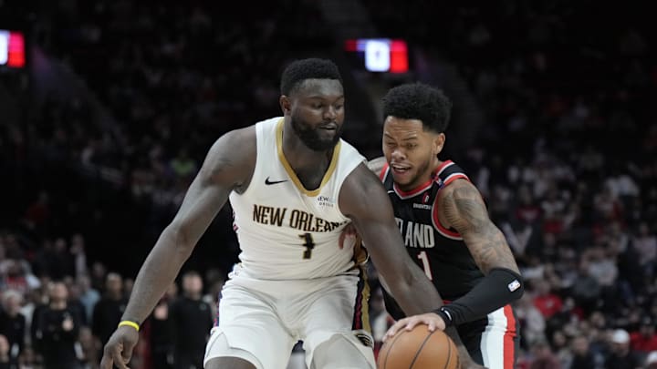 Oct 25, 2024; Portland, Oregon, USA; Portland Trail Blazers shooting guard Anfernee Simons (1) dribbles the ball while defended by New Orleans Pelicans power forward Zion Williamson (1) during the second half at Moda Center. Mandatory Credit: Soobum Im-Imagn Images Oct 25, 2024; Portland, Oregon, USA; Portland Trail Blazers shooting guard Anfernee Simons (1) dribbles the ball while defended by New Orleans Pelicans power forward Zion Williamson (1) during the second half at Moda Center. Mandatory Credit: Soobum Im-Imagn Images