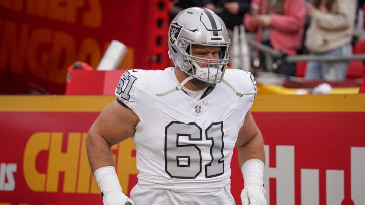 Dec 25, 2023; Kansas City, Missouri, USA; Las Vegas Raiders guard Jordan Meredith (61) runs onto the field against the Kansas City Chiefs prior to a game at GEHA Field at Arrowhead Stadium. Mandatory Credit: Denny Medley-USA TODAY Sports Dec 25, 2023; Kansas City, Missouri, USA; Las Vegas Raiders guard Jordan Meredith (61) runs onto the field against the Kansas City Chiefs prior to a game at GEHA Field at Arrowhead Stadium. Mandatory Credit: Denny Medley-USA TODAY Sports