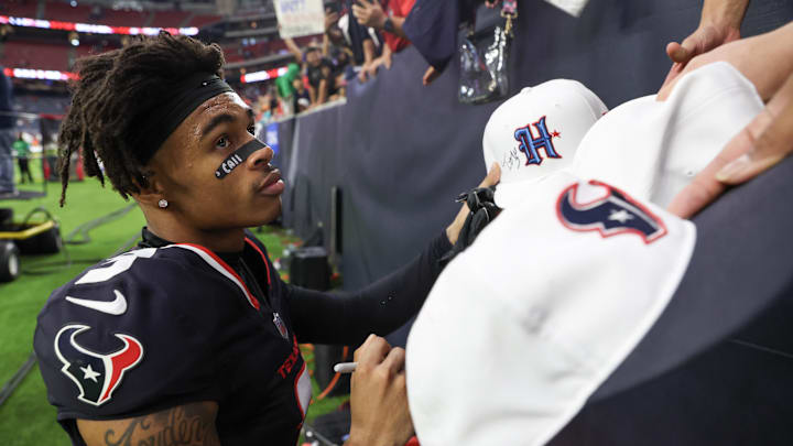 Dec 15, 2024; Houston, Texas, USA; Houston Texans wide receiver Tank Dell (3) signs autographs after defeating the Miami Dolphins at NRG Stadium. Mandatory Credit: Thomas Shea-Imagn Images Dec 15, 2024; Houston, Texas, USA; Houston Texans wide receiver Tank Dell (3) signs autographs after defeating the Miami Dolphins at NRG Stadium. Mandatory Credit: Thomas Shea-Imagn Images