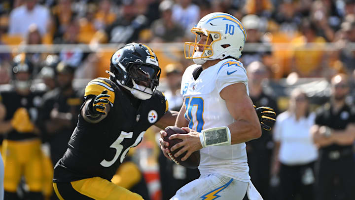 Sep 22, 2024; Pittsburgh, Pennsylvania, USA; Pittsburgh Steelers linebacker Elandon Roberts (50) sacks Los Angeles Chargers quarterback Justin Herbert (10) during the third quarter at Acrisure Stadium. Mandatory Credit: Barry Reeger-Imagn Images