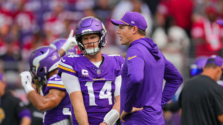 Sep 15, 2024; Minneapolis, Minnesota, USA; Minnesota Vikings quarterback Sam Darnold (14) and head coach Kevin O'Connell talk before the game against the San Francisco 49ers at U.S. Bank Stadium. Mandatory Credit: Brad Rempel-Imagn Images Sep 15, 2024; Minneapolis, Minnesota, USA; Minnesota Vikings quarterback Sam Darnold (14) and head coach Kevin O'Connell talk before the game against the San Francisco 49ers at U.S. Bank Stadium. Mandatory Credit: Brad Rempel-Imagn Images