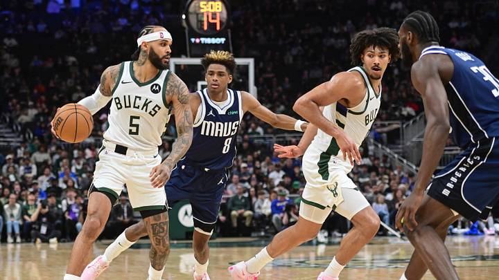 Mar 31, 2026; Milwaukee, Wisconsin, USA; Milwaukee Bucks forward Gary Trent Jr. (5) drives for the basket against Dallas Mavericks guard AJ Johnson (8) and center Moussa Cisse (30) in the second quarter at Fiserv Forum. Mandatory Credit: Benny Sieu-Imagn Images Mar 31, 2026; Milwaukee, Wisconsin, USA; Milwaukee Bucks forward Gary Trent Jr. (5) drives for the basket against Dallas Mavericks guard AJ Johnson (8) and center Moussa Cisse (30) in the second quarter at Fiserv Forum. Mandatory Credit: Benny Sieu-Imagn Images
