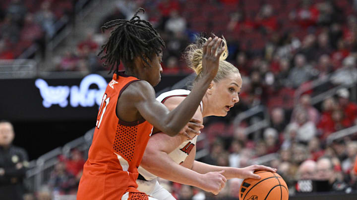 Jan 4, 2026; Louisville, Ky; Louisville forward Laura Ziegler (0) dribbles against Virginia Tech guard Mel Daley (21).