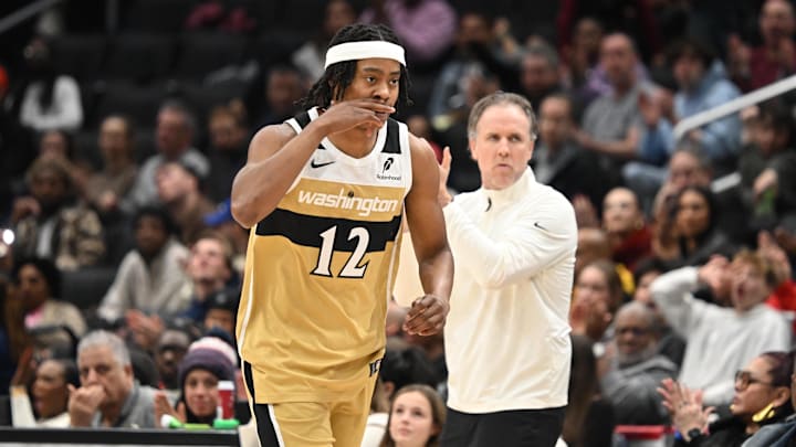 Dec 29, 2025; Washington, District of Columbia, USA;  Washington Wizards guard Tre Johnson (12) gestures after scoring a basket against the Phoenix Suns during the second quarter at Capital One Arena. Mandatory Credit: Rafael Suanes-Imagn Images