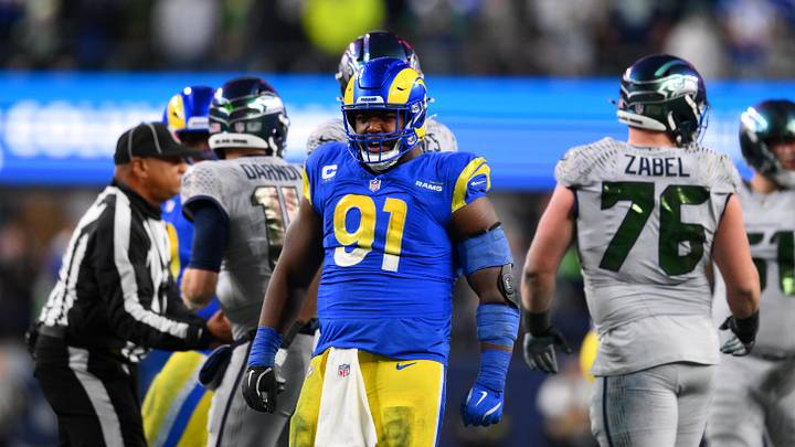 Dec 18, 2025; Seattle, Washington, USA; Los Angeles Rams defensive end Kobie Turner (91) reacts after a sack against the Seattle Seahawks in the second half at Lumen Field. Mandatory Credit: Steven Bisig-Imagn Images