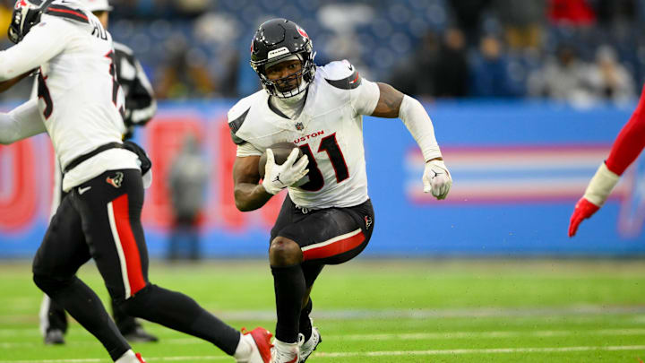 Jan 5, 2025; Nashville, Tennessee, USA;  Houston Texans running back Dameon Pierce (31) runs the ball against the Tennessee Titans during the second half at Nissan Stadium. Mandatory Credit: Steve Roberts-Imagn Images