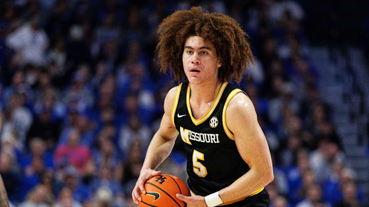 Jan 7, 2026; Lexington, Kentucky, USA; Missouri Tigers guard T.O. Barrett (5) handles the ball during the first half against the Kentucky Wildcats at Rupp Arena at Central Bank Center. Mandatory Credit: Jordan Prather-Imagn Images