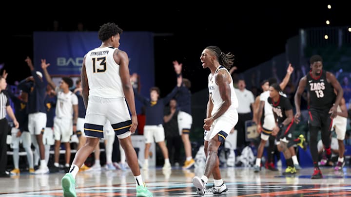 Nov 27, 2024; Paradise Island, Bahamas, BHS; West Virginia Mountaineers guard Javon Small (7) celebrates with West Virginia Mountaineers forward Amani Hansberry (13) during the second half against the Gonzaga Bulldogs at the Atlantis Resort.  Mandatory Credit: Kevin Jairaj-Imagn Images