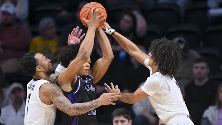 Dec 13, 2025; Nashville, Tennessee, USA; Vanderbilt Commodores guard Frankie Collins (1) and guard Tyler Tanner (3) trap Central Arkansas Bears guard Camren Hunter (1)  during the second half at Memorial Gymnasium. Mandatory Credit: Steve Roberts-Imagn Images