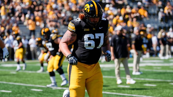 Iowa Hawkeyes offensive lineman Gennings Dunker (67) warms up before a football game against the Indiana Hoosiers Sept. 27, 2025 at Kinnick Stadium in Iowa City, Iowa.