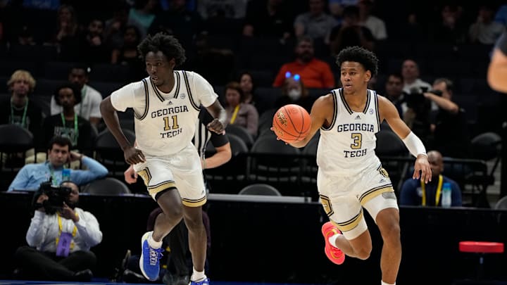 Mar 12, 2025; Charlotte, NC, USA; Georgia Tech Yellow Jackets guard Jaeden Mustaf (3) and forward Baye Ndongo (11) on the fast break in the first half at Spectrum Center. Mandatory Credit: Bob Donnan-Imagn Images