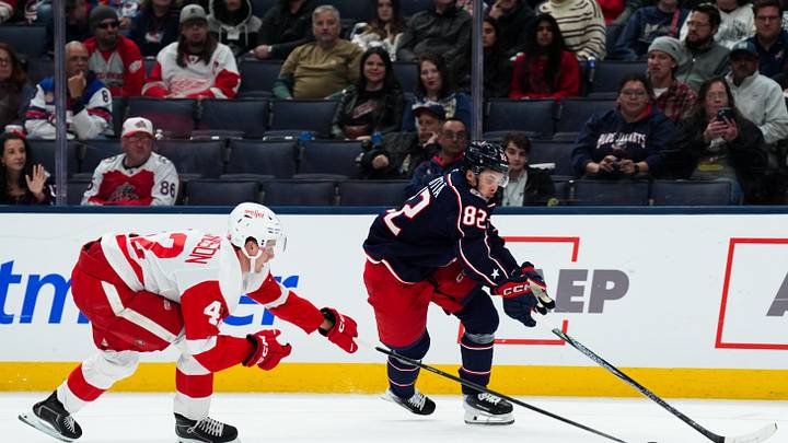 Sep 21, 2026; Columbus, Ohio, USA; Columbus Blue Jackets forward Mikael Pyyhtia (82) skates with the puck against Detroit Red Wings defense Anton Johansson (42) in the second period at Nationwide Arena. Mandatory Credit: Aaron Doster-Imagn Images Sep 21, 2026; Columbus, Ohio, USA; Columbus Blue Jackets forward Mikael Pyyhtia (82) skates with the puck against Detroit Red Wings defense Anton Johansson (42) in the second period at Nationwide Arena. Mandatory Credit: Aaron Doster-Imagn Images