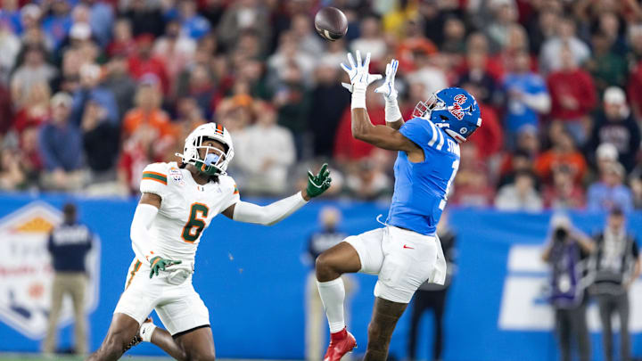 Jan 8, 2026; Glendale, AZ, USA; Mississippi Rebels wide receiver De'Zhaun Stribling (1) against Miami Hurricanes defensive back Xavier Lucas (6) during the 2026 Fiesta Bowl and semifinal game of the College Football Playoff at State Farm Stadium. Mandatory Credit: Mark J. Rebilas-Imagn Images