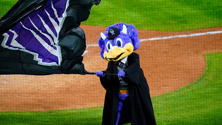Colorado Rockies mascot Dinger the Dinosaur celebrates the win over the St. Louis Cardinals at Coors Field. Credit: Ron Chenoy-Imagn Images Colorado Rockies mascot Dinger the Dinosaur celebrates the win over the St. Louis Cardinals at Coors Field. Credit: Ron Chenoy-Imagn Images