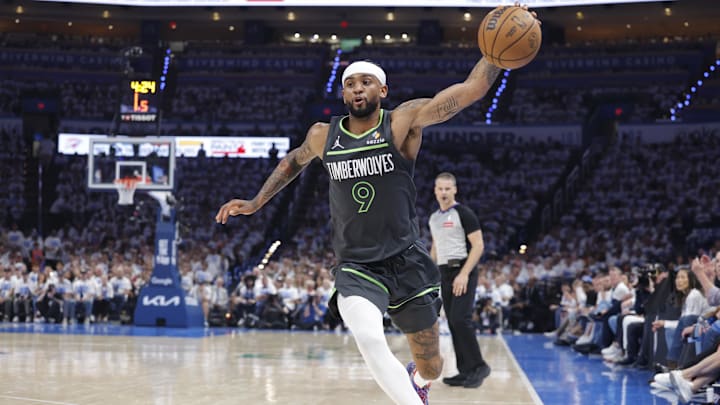 May 20, 2025; Oklahoma City, Oklahoma, USA; Minnesota Timberwolves guard Nickeil Alexander-Walker (9) saves a ball against the Oklahoma City Thunder in the second quarter during game one of the western conference finals for the 2025 NBA Playoffs at Paycom Center. Mandatory Credit: Alonzo Adams-Imagn Images