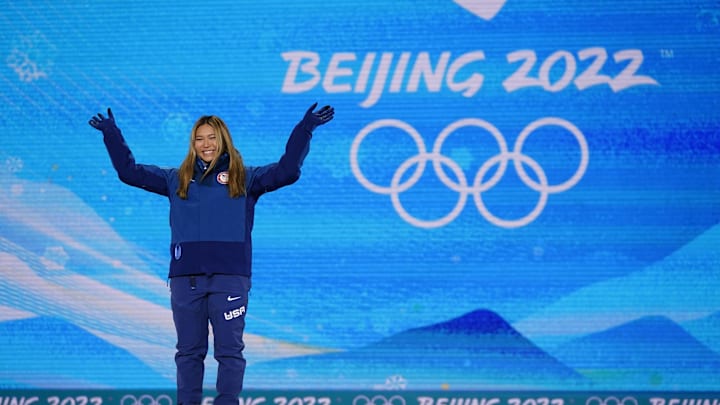Chloe Kim wins gold during the medals ceremony for the women's snowboard halfpipe at the Beijing 2022 Olympic Winter Games at Zhangjiakou Medals Plaza.