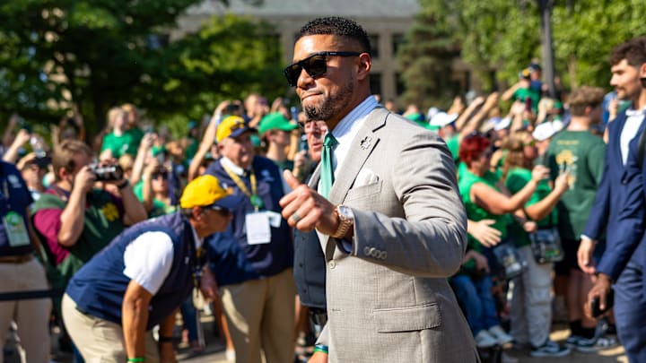 Oct 4, 2025; South Bend, Indiana, USA; Notre Dame Fighting Irish head coach Marcus Freeman gives a thumbs up to fans while walking to the stadium before a game against the Boise State Broncos at Notre Dame Stadium. Mandatory Credit: Michael Caterina-Imagn Images Oct 4, 2025; South Bend, Indiana, USA; Notre Dame Fighting Irish head coach Marcus Freeman gives a thumbs up to fans while walking to the stadium before a game against the Boise State Broncos at Notre Dame Stadium. Mandatory Credit: Michael Caterina-Imagn Images