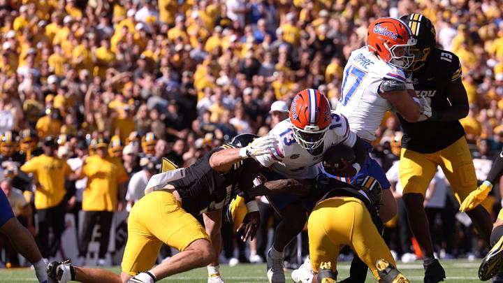 Oct 3, 2026; Columbia, Missouri, USA;  Florida Gators running back Jadan Baugh (13) dives with the ball in the first quarter against the Missouri Tigers at Faurot Field at Memorial Stadium.  Mandatory Credit: William Purnell-Imagn Images