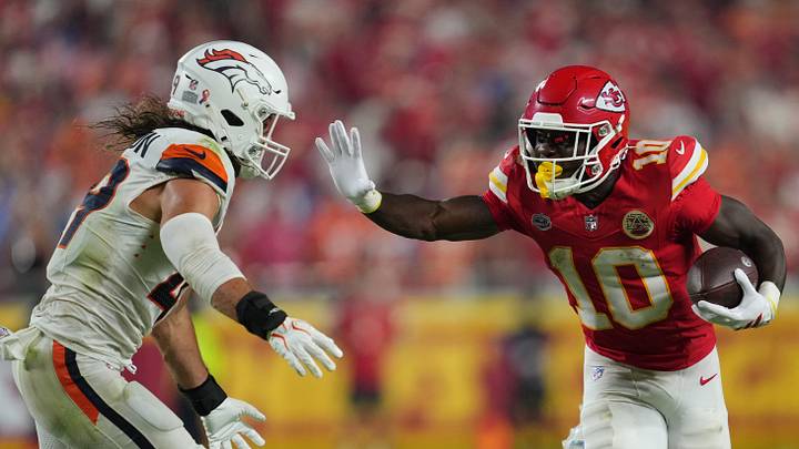 Sep 14, 2026; Kansas City, Missouri, USA; Kansas City Chiefs running back Emmett Johnson (10) rushes the ball against Denver Broncos linebacker Alex Singleton (49) at GEHA Field at Arrowhead Stadium. Mandatory Credit: Jay Biggerstaff-Imagn Images Sep 14, 2026; Kansas City, Missouri, USA; Kansas City Chiefs running back Emmett Johnson (10) rushes the ball against Denver Broncos linebacker Alex Singleton (49) at GEHA Field at Arrowhead Stadium. Mandatory Credit: Jay Biggerstaff-Imagn Images