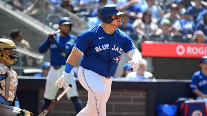 May 19, 2024; Toronto, Ontario, CAN; Toronto Blue Jays designated hitter Daniel Vogelbach (20) hits a single against the Tampa Bay Rays in the sixth inning at Rogers Centre. Mandatory Credit: Dan Hamilton-USA TODAY Sports