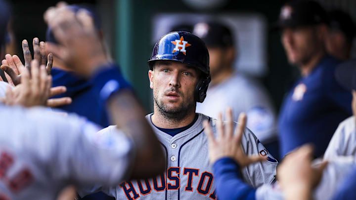 Sep 4, 2024; Cincinnati, Ohio, USA; Houston Astros third baseman Alex Bregman (2) high fives teammates after scoring on a RBI single hit by outfielder Ben Gamel (not pictured) in the second inning against the Cincinnati Reds at Great American Ball Park. Mandatory Credit: Katie Stratman-Imagn Images