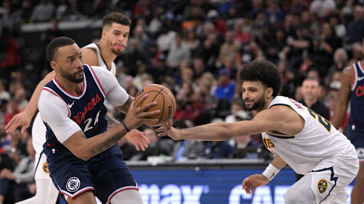 Apr 26, 2025; Inglewood, California, USA; Los Angeles Clippers guard Norman Powell (24) is defended by Denver Nuggets guard Jamal Murray (27) as he drives to the basket in the second half of game four of round one of the 2024 NBA Playoffs at Intuit Dome. Mandatory Credit: Jayne Kamin-Oncea-Imagn Images