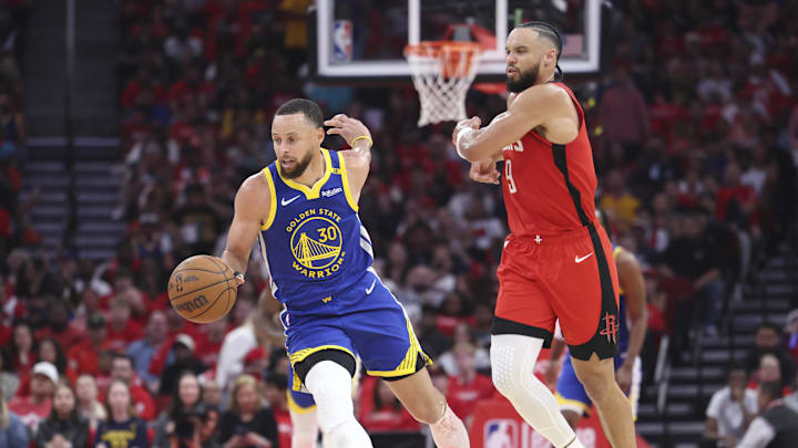 Apr 20, 2025; Houston, Texas, USA; Golden State Warriors guard Stephen Curry (30) controls the ball as Houston Rockets forward Dillon Brooks (9) defends during the second quarter at Toyota Center. Mandatory Credit: Troy Taormina-Imagn Images