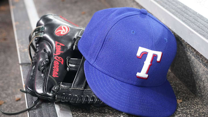 The hat and glove of Texas Rangers fielder Leody Taveras (3) during a game against the Toronto Blue Jays at Rogers Centre in 2024.