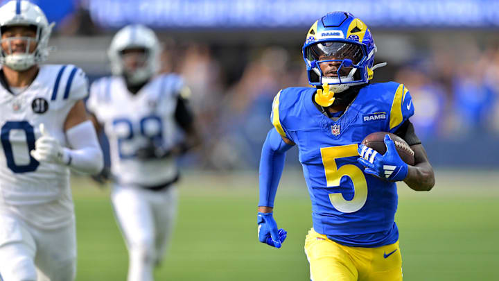 Sep 28, 2025; Inglewood, California, USA; Los Angeles Rams wide receiver Tutu Atwell (5) runs for a touchdown on an 88 yard pass play in the fourth quarter against the Indianapolis Colts at SoFi Stadium. Mandatory Credit: Jayne Kamin-Oncea-Imagn Images