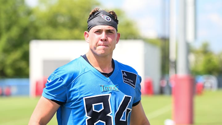 Jul 23, 2025; Nashville, TN, USA;  Tennessee Titans tight end Gunnar Helm (84) walks off the field during training camp at Ascension Saint Thomas Sports Park. Mandatory Credit: Steve Roberts-Imagn Images