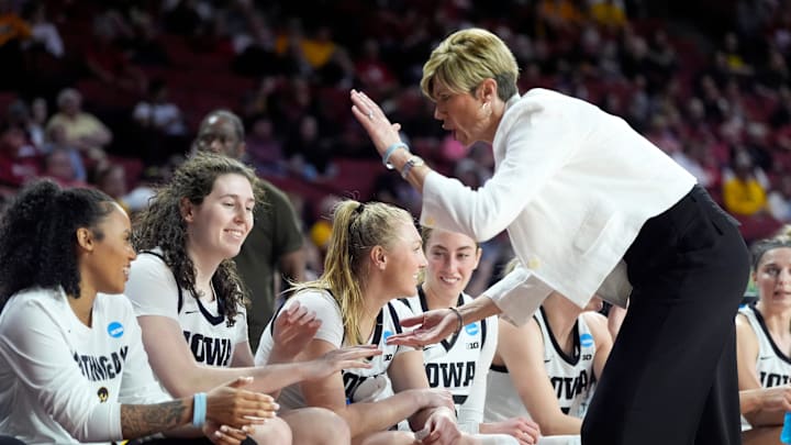 Iowa head women's basketball coach Jan Jensen congratulates players during second half of the first round of the NCAA Women's college basketball game between Iowa and Murray State at the Lloyd Noble Center in Norman, Okla., Saturday, March, 22, 2025. Iowa head women's basketball coach Jan Jensen congratulates players during second half of the first round of the NCAA Women's college basketball game between Iowa and Murray State at the Lloyd Noble Center in Norman, Okla., Saturday, March, 22, 2025.
