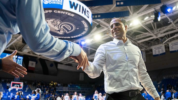Drake head coach Ben McCollum shakes hands with fans after a game on Monday, Nov. 4, 2024, at the Knapp Center. Drake head coach Ben McCollum shakes hands with fans after a game on Monday, Nov. 4, 2024, at the Knapp Center.