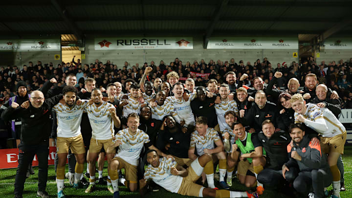 Tamworth players celebrate their win over Burton Albion in round two