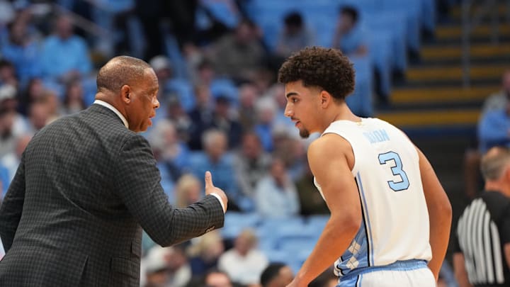  North Carolina Tar Heels head coach Hubert Davis with guard Derek Dixon (3)