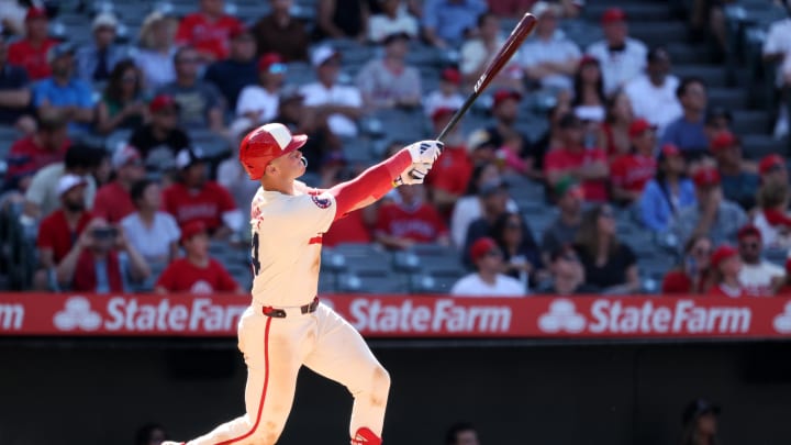 Jun 9, 2024; Anaheim, California, USA;  Los Angeles Angels catcher Logan O'Hoppe (14) hits a game winning 2-run home run in bottom of the ninth inning against the Houston Astros at Angel Stadium. Mandatory Credit: Kiyoshi Mio-USA TODAY Sports