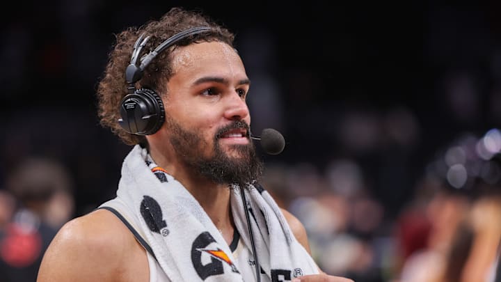 Feb 7, 2025; Atlanta, Georgia, USA; Atlanta Hawks guard Trae Young (11) does an interview after a victory against the Milwaukee Bucks in the fourth quarter at State Farm Arena. Mandatory Credit: Brett Davis-Imagn Images
