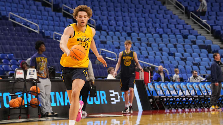 Mar 18, 2026; Buffalo, NY, USA; Michigan Wolverines center Malick Kordel (32) chases the ball during a practice session ahead of the first round of the men's 2026 NCAA Tournament at Keybank Center. Mandatory Credit: Gregory Fisher-Imagn Images