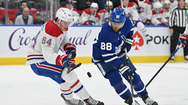 Sep 26, 2024; Toronto, Ontario, CAN; Toronto Maple Leafs forward William Nylander (88) battles for the puck with Montreak Canadiens defenseman David Reinbacher (64) in the first period at Scotiabank Arena. Mandatory Credit: Dan Hamilton-Imagn Images Sep 26, 2024; Toronto, Ontario, CAN; Toronto Maple Leafs forward William Nylander (88) battles for the puck with Montreak Canadiens defenseman David Reinbacher (64) in the first period at Scotiabank Arena. Mandatory Credit: Dan Hamilton-Imagn Images