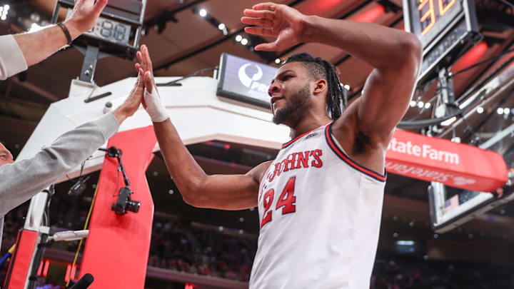 Feb 4, 2025; New York, New York, USA;  St. John's basketball forward Zuby Ejiofor (24) high fans the fans in the second half against the Marquette Golden Eagles at Madison Square Garden. 