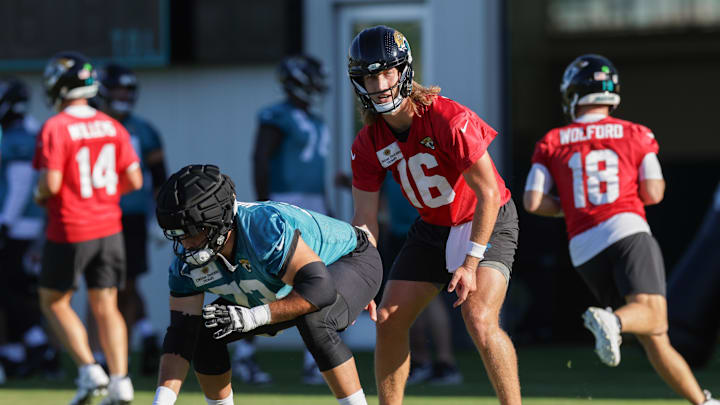 Jul 24, 2025; Jacksonville, FL, USA; Jacksonville Jaguars quarterback Trevor Lawrence (16) and center Robert Hainsey (73) participate in training camp at Miller Electric Center. Mandatory Credit: Nathan Ray Seebeck-Imagn Images