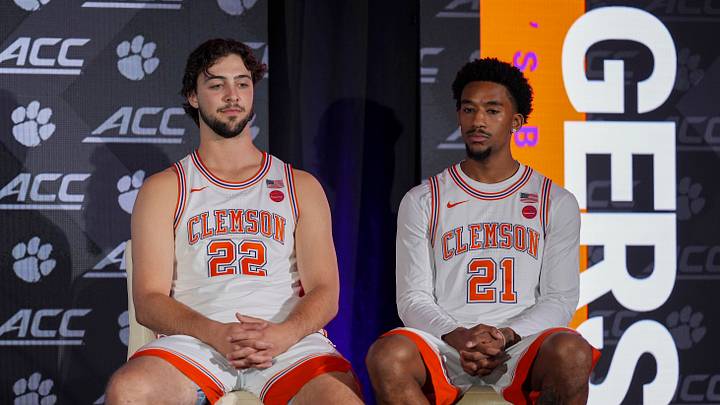 Oct 7, 2026; Charlotte, NC, USA;  Clemson Tigers Carter Welling and Ace Buckner listen to their coach answer questions from the media during the ACC Tip-Off in Charlotte, NC.  Mandatory Credit: Jim Dedmon-Imagn Images