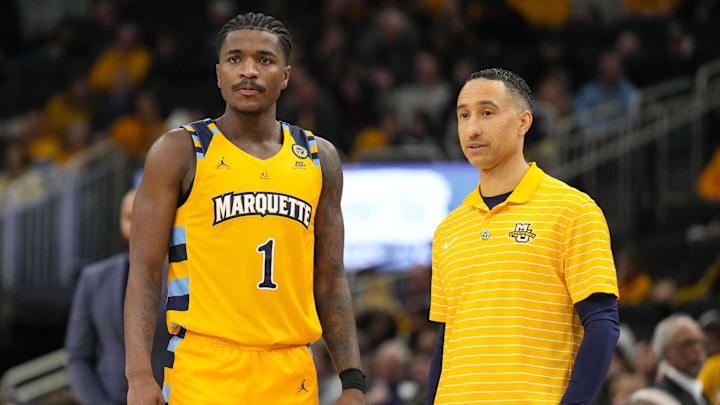 Jan 24, 2025; Milwaukee, Wisconsin, USA; Marquette Golden Eagles head coach Shaka Smart talks with guard Kam Jones (1) during the second half against the Villanova Wildcats at Fiserv Forum. Mandatory Credit: Jeff Hanisch-Imagn Images Jan 24, 2025; Milwaukee, Wisconsin, USA; Marquette Golden Eagles head coach Shaka Smart talks with guard Kam Jones (1) during the second half against the Villanova Wildcats at Fiserv Forum. Mandatory Credit: Jeff Hanisch-Imagn Images