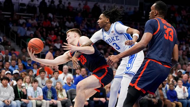 Mar 14, 2026; Charlotte, NC, USA; Virginia Cavaliers forward Thijs de Ridder (28) rebounds the ball against Duke Blue Devils guard Isaiah Evans (3) during the men's ACC Conference Tournament Championship at Spectrum Center. Mandatory Credit: Bob Donnan-Imagn Images Mar 14, 2026; Charlotte, NC, USA; Virginia Cavaliers forward Thijs de Ridder (28) rebounds the ball against Duke Blue Devils guard Isaiah Evans (3) during the men's ACC Conference Tournament Championship at Spectrum Center. Mandatory Credit: Bob Donnan-Imagn Images