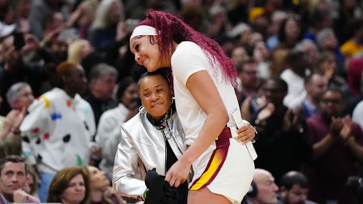 Apr 7, 2024; Cleveland, OH, USA; South Carolina Gamecocks center Kamilla Cardoso (10) embraces head coach Dawn Staley.