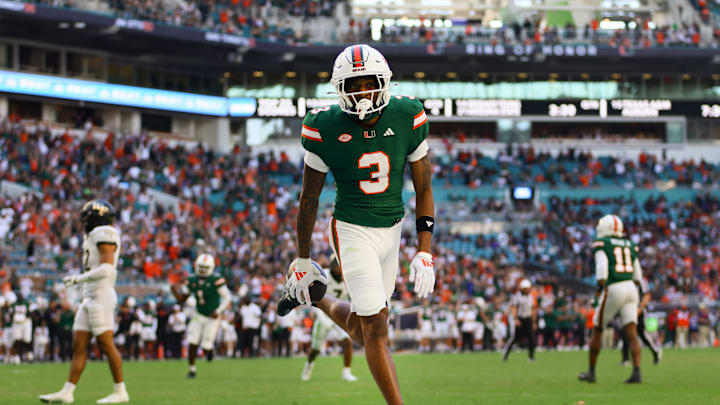 Nov 23, 2024; Miami Gardens, Florida, USA; Miami Hurricanes wide receiver Jacolby George (3) scores a touchdown against the Wake Forest Demon Deacons during the fourth quarter at Hard Rock Stadium. Mandatory Credit: Sam Navarro-Imagn Images
