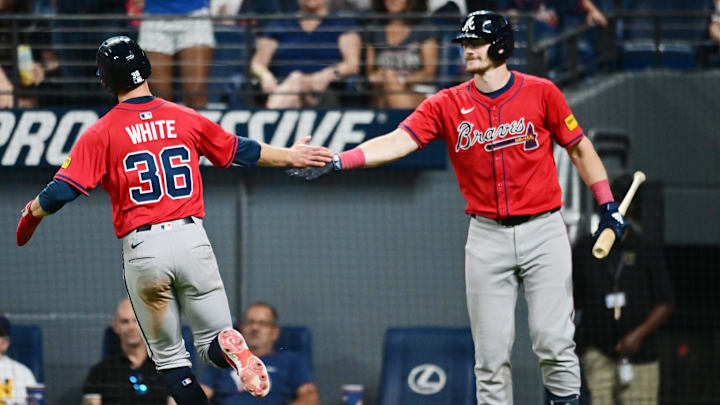 Aug 15, 2025; Cleveland, Ohio, USA; Atlanta Braves pinch runner Eli White (36) celebrates after scoring with catcher Sean Murphy (12) during the ninth inning against the Cleveland Guardians at Progressive Field. Mandatory Credit: Ken Blaze-Imagn Images