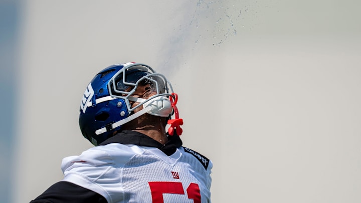 New York Giants linebacker Abdul Carter (51) spits water out during day one of the New York Giants training camp at Quest Diagnostics Giants Training Center in East Rutherford on Wednesday, July 23, 2025.