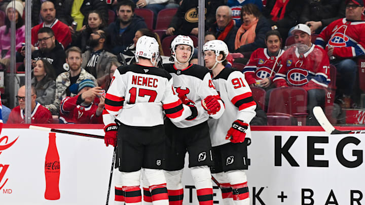 Simon Nemec and Luke Hughes celebrate a goal with New Jersey Devils teammate Dawson Mercer Simon Nemec and Luke Hughes celebrate a goal with New Jersey Devils teammate Dawson Mercer