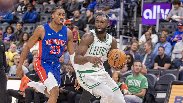 Oct 26, 2024; Detroit, Michigan, USA; Detroit Pistons guard Jaden Ivey (23) defends against Boston Celtics guard Jaylen Brown (7) during the in the first half at Little Caesars Arena. Mandatory Credit: David Reginek-Imagn Images